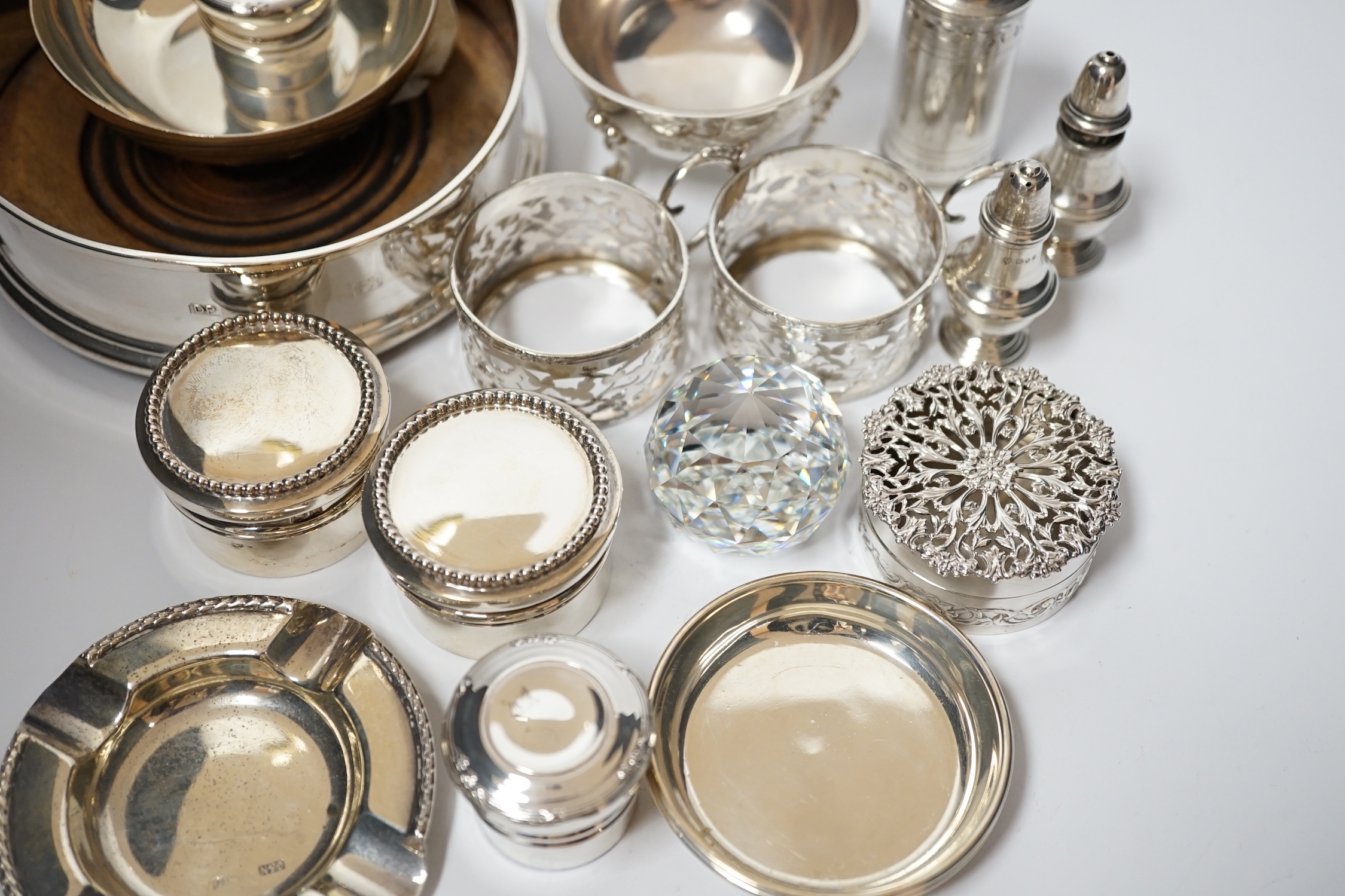 A small collection of sundry small silver including modern silver mounted wine coaster, coffee can holders, salt, taste vin, pot pourri box, pill boxes, Georgian pepperette, small dishes etc.